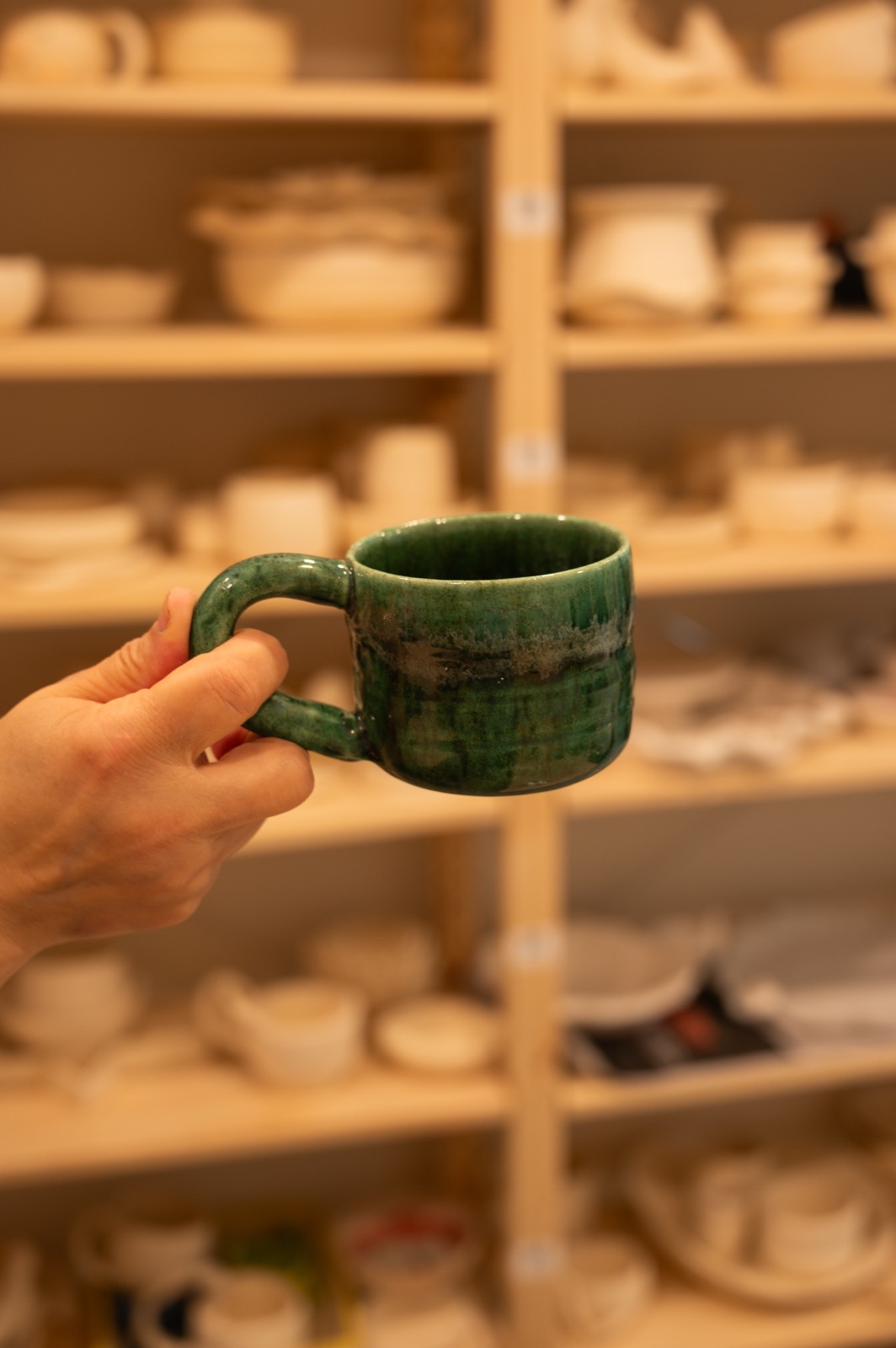 A finished ceramic mug made at Lemarsis Pottery Studio