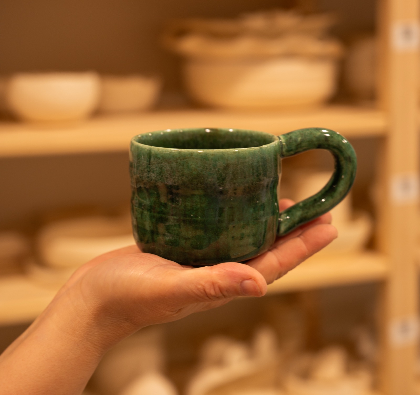 A finished ceramic mug made at Lemarsis Pottery Studio
