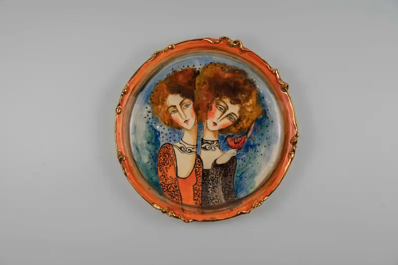 Ceramic plate by Marjan: two portraits